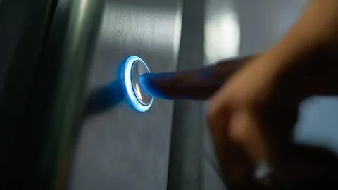 Finger Of Man Pressing Button For Call The Elevator In The Palace Foto stock