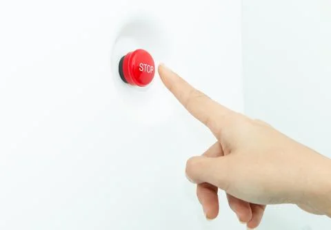 Finger man pushing big red stop alarm panic button with finger. Stock Photos