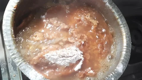 Finger Millet Flour Dough Boiling on Stove with Steam and Bubbling Texture Stock Footage 335125212