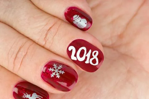 Finger nail with christmas pattern Stock Photos
