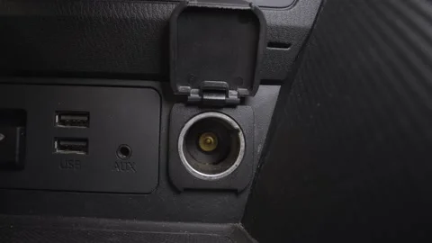 Finger open 12 volt 120 watt charger socket for electronic equipment in car. Stock Footage 236930085