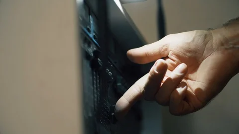 Finger operating dimmer switch for stage light. Adjusting level with Stock Footage 129807437