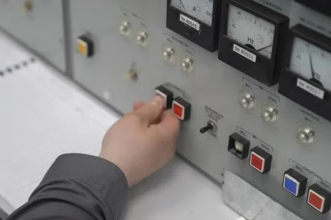 Finger on parameter value adjustment button on the control panel Stock Photos