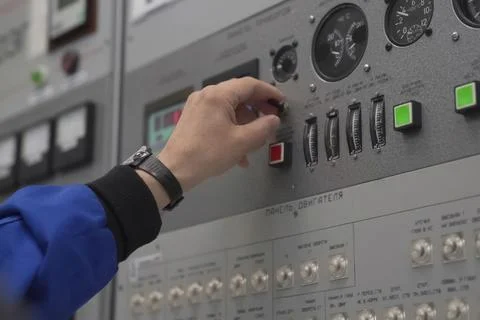 Finger on parameter value adjustment button on the control panel Stock Photos