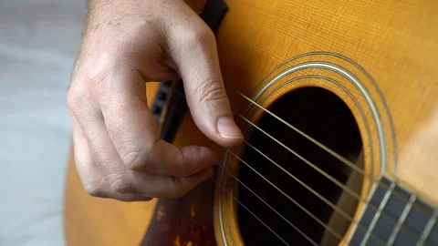 Finger picking guitar, closeup of hand playing acoustic guitar Stock Footage 101312405