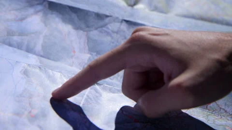 Finger pointed on a map, checking the trail Stock Footage 47164304
