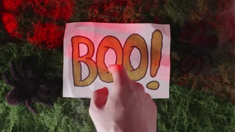 Finger pointing at BOO text with smoke explosion in lightning Stock-Footage 342520429