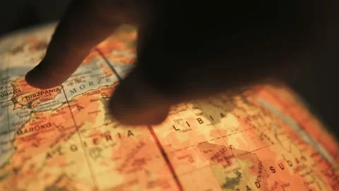 Finger pointing on earth globe Stock Footage 98466583