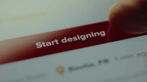 Finger points to the Start designing button, clothes customization on an online Stock Footage 327900730
