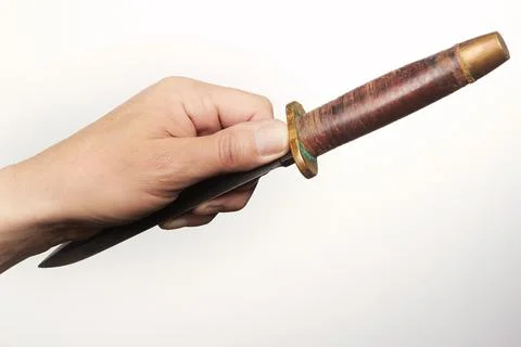 Finger position when throwing knives, daggers and one blade weapons Stock Photos