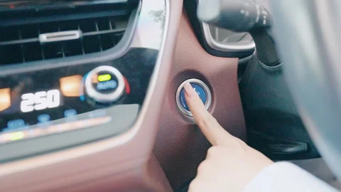 Finger press a car ignition button or START engine inside modern electric a.. Stock Footage 302133841