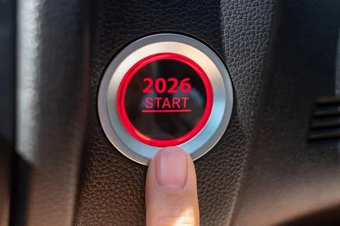 Finger press a car ignition button with 2026 START text inside  automobile... Stock Photos