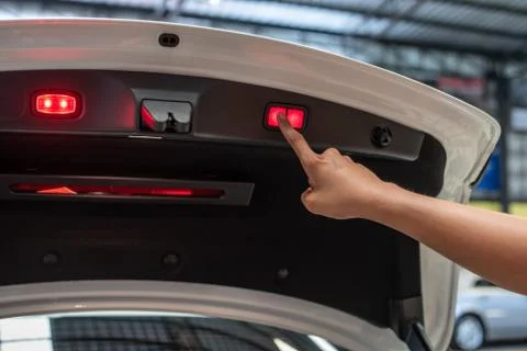 Finger Press On Red Button To Close Back Door Stock Photos