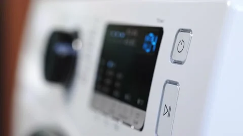 Finger press the switch to make the washing machine work. Home appliances Stock Footage 152749342