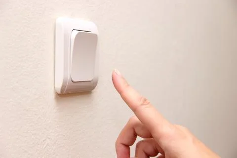 Finger press turn off electrical switch Stock Photos