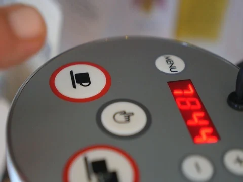 Finger Presses the Button on Automatic Coffee Espresso Machine Stock Footage 77226310