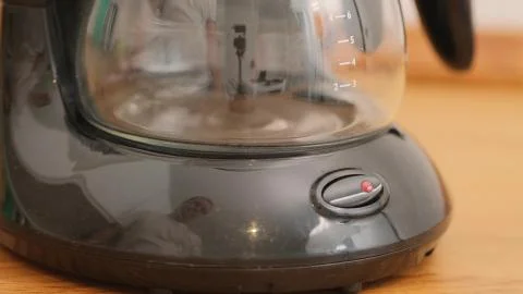 Finger presses Button on coffee machine Close up Stock Photos