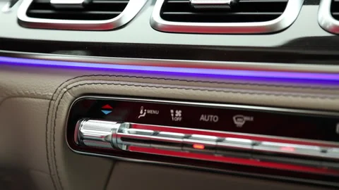 A finger presses the climate control button. The person makes the temperature in Stock Footage 163310509