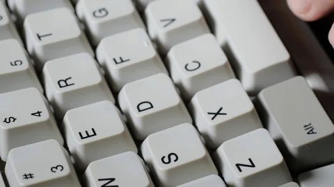 Finger presses E button on keyboard Stock-Footage 121071995