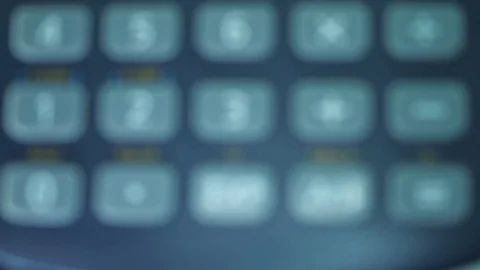 Finger presses the engineering calculator buttons. Closeup shot Stock-Footage 77406280