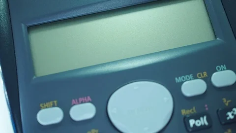 Finger presses the engineering calculator buttons. Closeup shot Stock-Footage 77406290