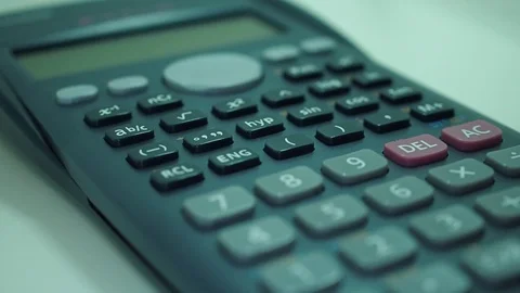 Finger presses the engineering calculator buttons. Closeup shot 動画素材 77406310
