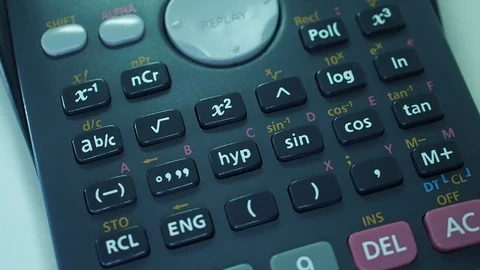Finger presses the engineering calculator buttons. Closeup shot Stock-Footage 77406313