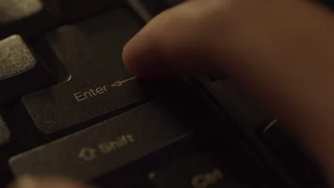 Finger presses the Enter key on the computer keyboard. Stock Footage 186941356