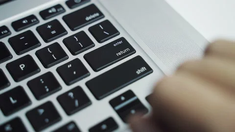 Finger presses the enter key several times Video stock 159829380