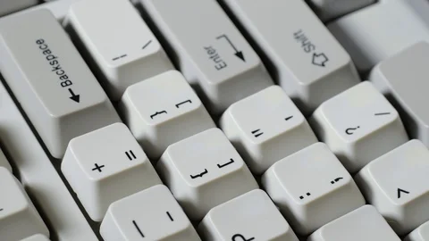 Finger presses equal or plus button on keyboard Stockbeeldmateriaal 121074448