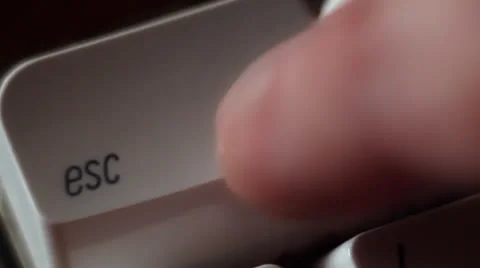 Finger presses the "escape" key Video stock 24899108