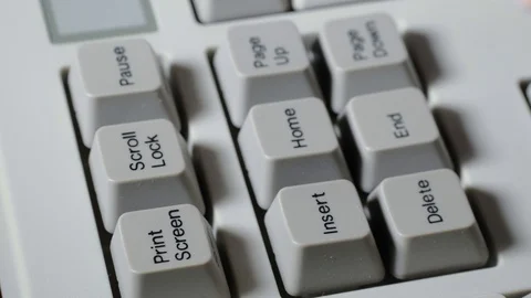 Finger presses INSERT button on keyboard Stock Footage 121077193