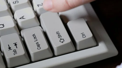 Finger presses left SHIFT button on keyboard Stock-Footage 121071798