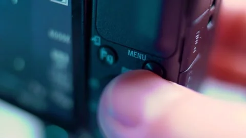 The finger presses the menu button of the video camera. Close-up Stock Footage 166701442