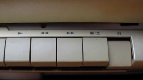Finger presses the pause button on an old retro tape player, close up Video stock 147611975