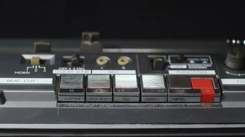 Finger presses the play button on an old vintage cassette recorder - close-up Stock Footage 170717624