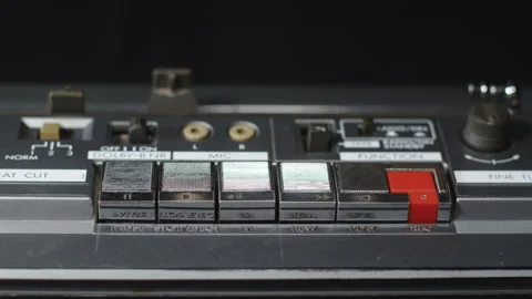 Finger presses the play button on an old vintage cassette recorder - close-up Stock Footage 170998495