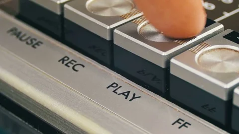Finger Presses Playback Control Buttons on Audio Cassette Player Stock Footage 74891064