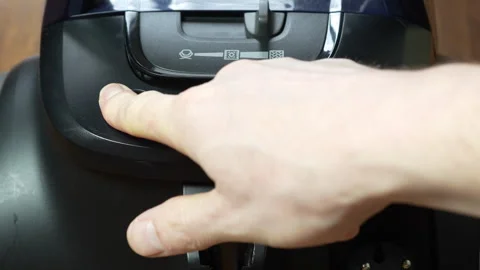 Finger Presses Power Button on Vacuum Cleaner Stock Footage 306135512