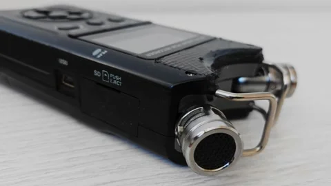 Finger presses record button of digital voice audio dictophone during interview Видео 219939453