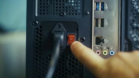 The finger presses the red power switch Stock Footage 327952462
