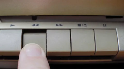 Finger presses the rewinding button on an old retro tape player, close up Video stock 148008908