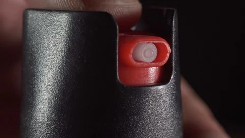 Finger presses use pepper spray for self defense Stock Footage 121481816