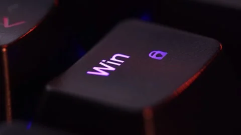 The finger presses Windows on the keyboard key, macro shot. Loop footage. Stock Footage 302920595