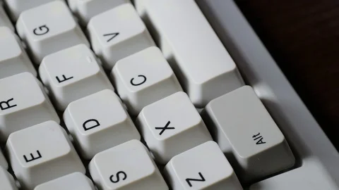 Finger presses X button on keyboard Stockbeeldmateriaal 121071955