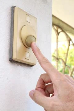 Finger pressing bell switch Stock Photos