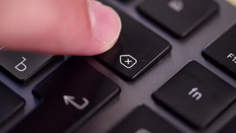 Finger pressing the black backspace delete button with an arrow icon. Pushi.. Stock Footage 340959061