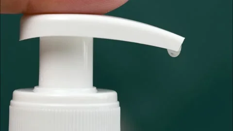 Finger pressing on button on the bottle with liquid soap Stock Footage 150859246