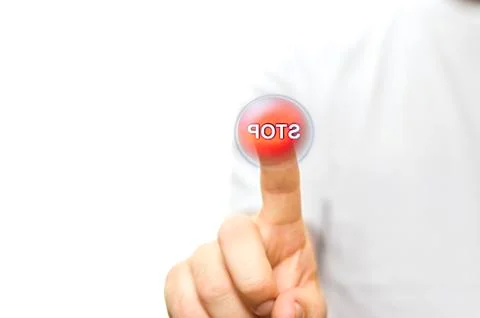 A finger pressing a button red stop button Stock Photos