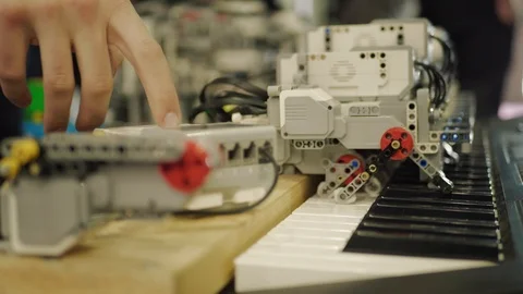 Finger pressing button, robot playing the piano. AI concept Stock Footage 105070364
